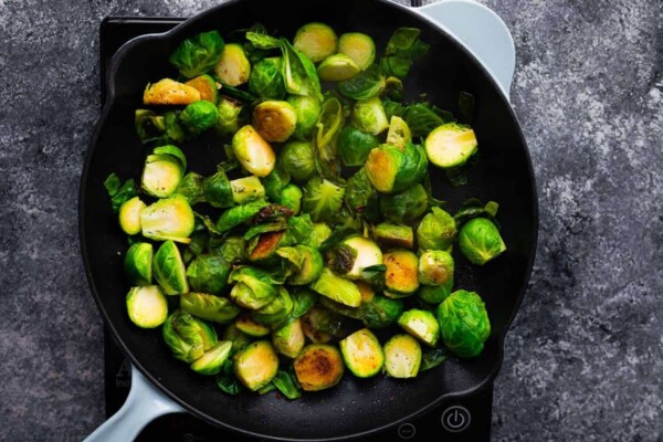 cooked brussels sprouts in a skillet