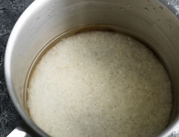 rice in clear water after rinsing