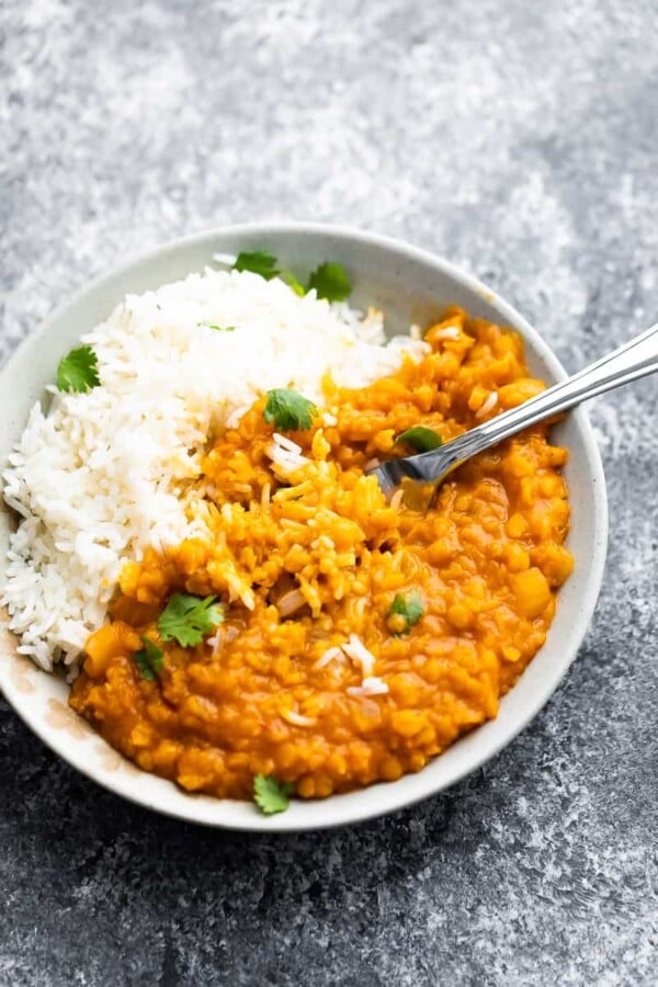 thai lentil curry mixed with rice in a bowl