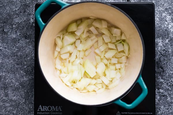 sauteing onions in blue pot