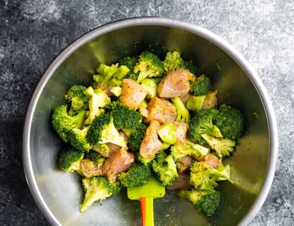 lemon pepper chicken and broccoli mixed up in silver bowl