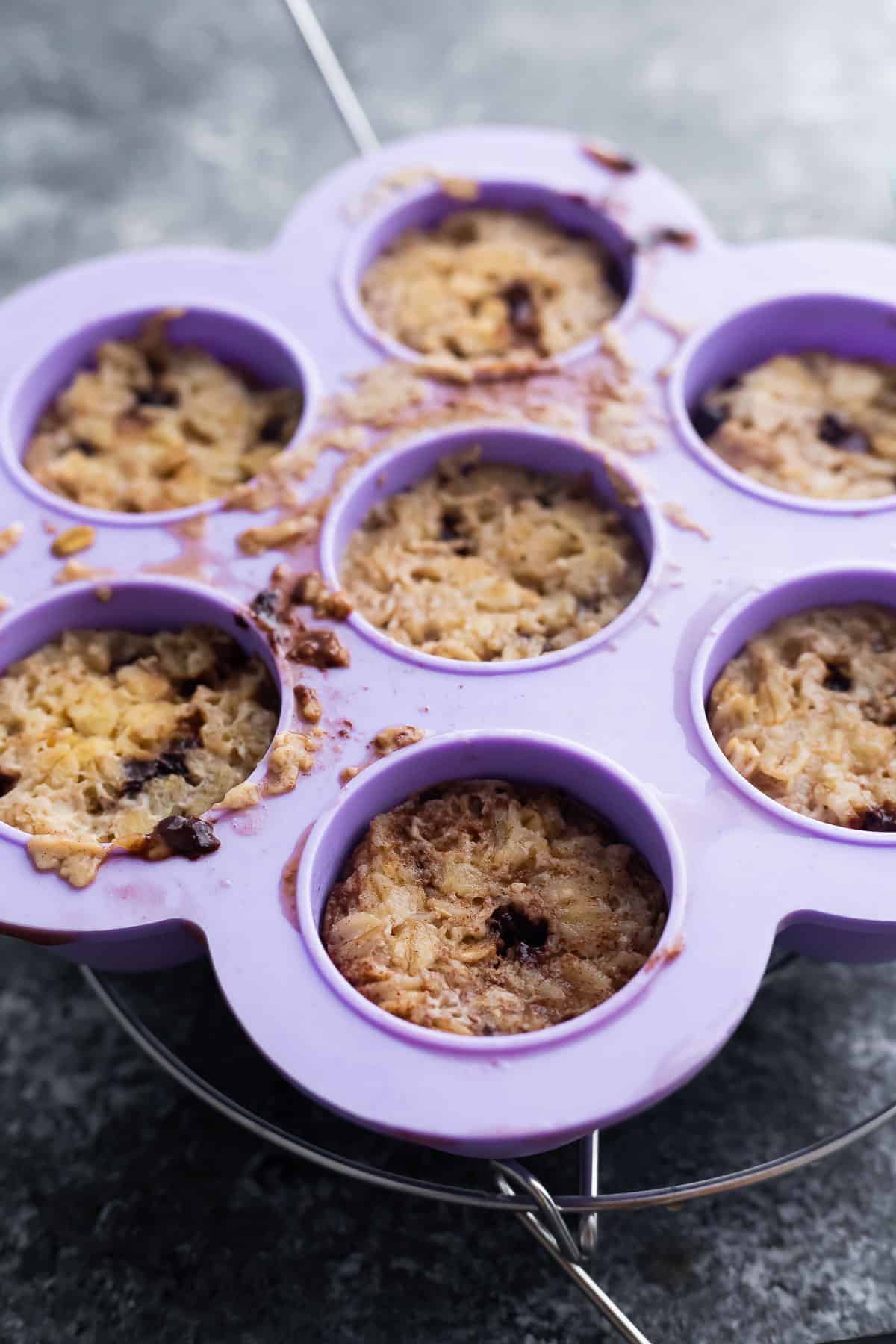 baked oatmeal in silicone molds cooling on trivet