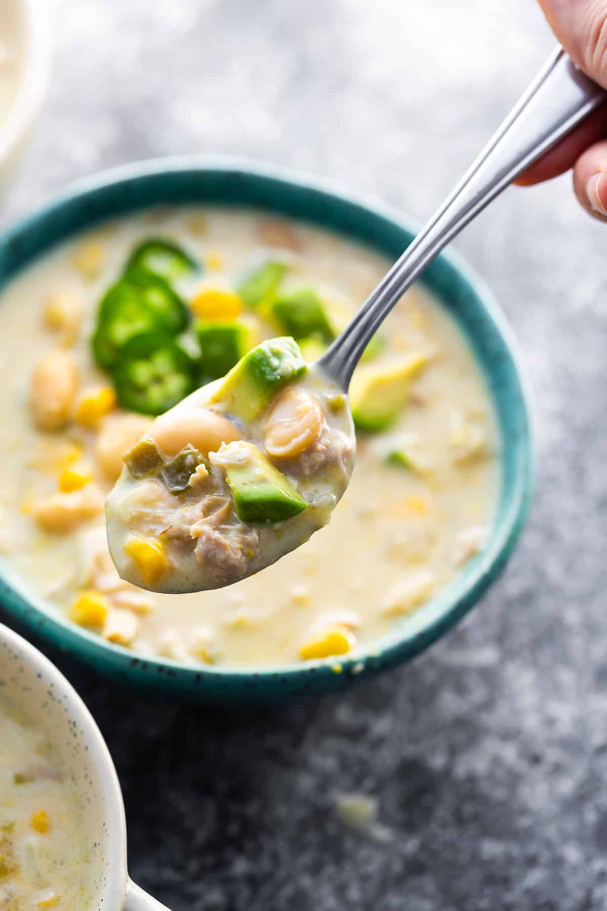 white chicken chili on spoon