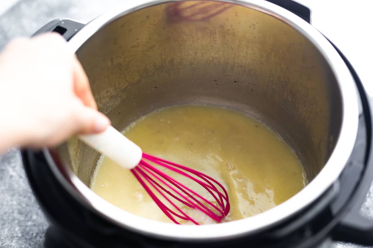 whisking a gravy in the Instant pot