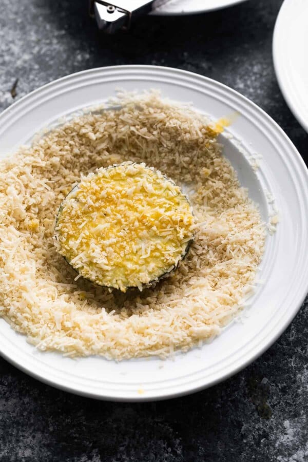 eggplant slice coated in panko mixture in a white bowl