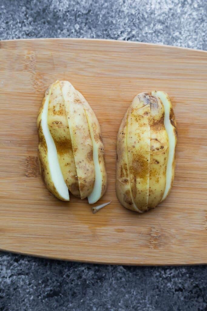 russet potato cut into 8 wedges, cut sides down on cutting board