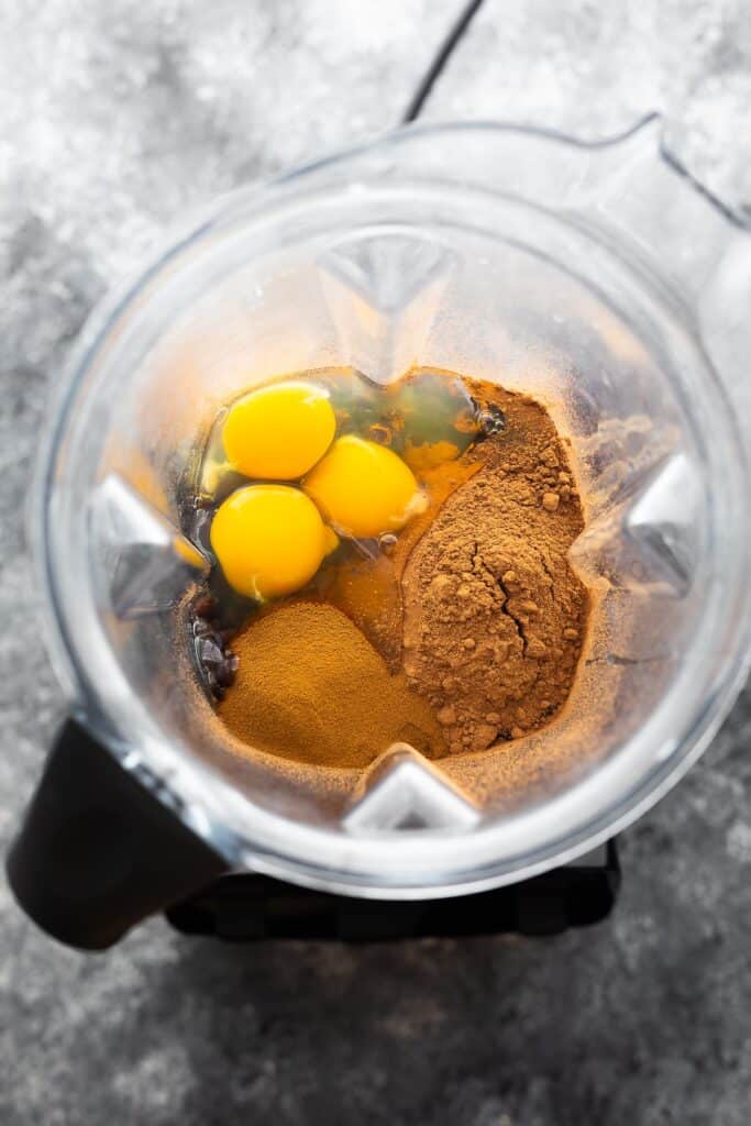 overhead view of ingredients for black bean brownies in a blender (before blending)