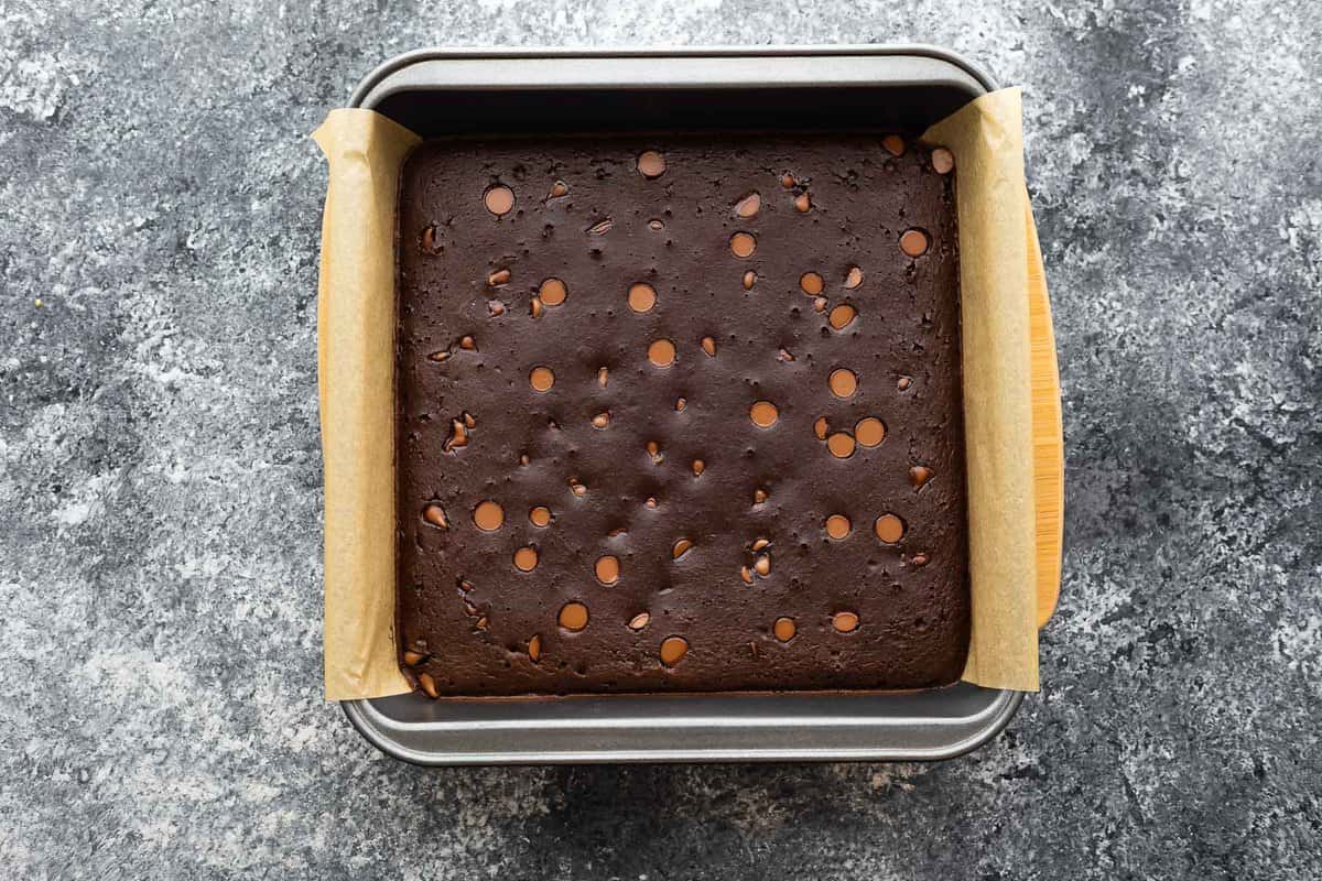 overhead view of black bean brownies in baking pan after baking through