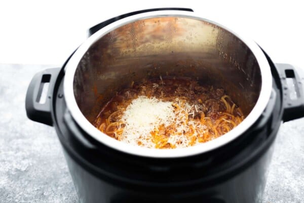 instant pot spaghetti with parmesan cheese on top