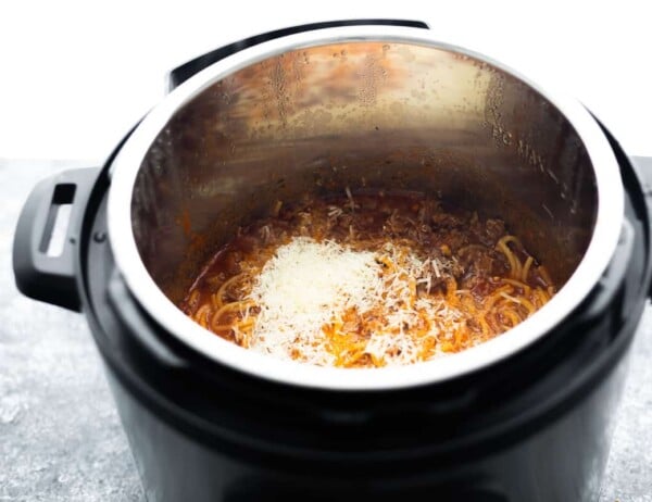 instant pot spaghetti with parmesan cheese on top