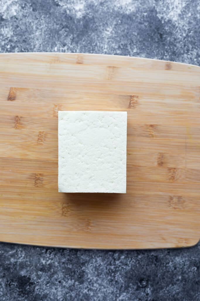 block of tofu on cutting board