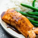 close up shot of balsamic salmon with reduction drizzled over it