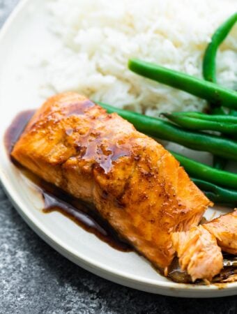close up shot of balsamic salmon with reduction drizzled over it