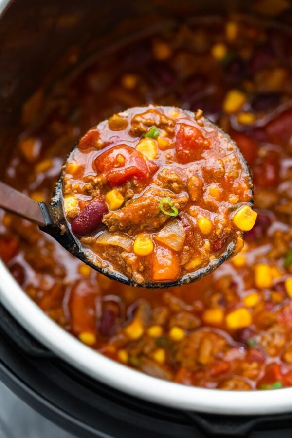 close up shot of chili on soup ladle