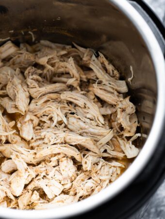 close up shot of shredded chicken in the instant pot