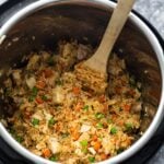 fried rice in instant pot with wooden spoon