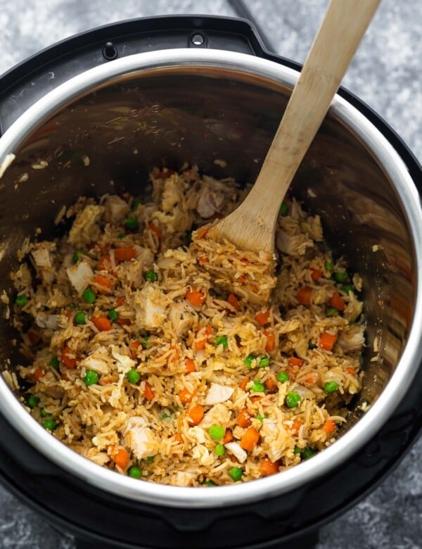 fried rice in instant pot with wooden spoon