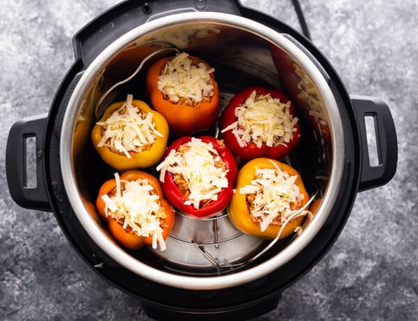 stuffed peppers in instant pot with cheese on top- uncooked