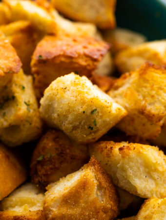 close up shot of air fryer croutons in bowl