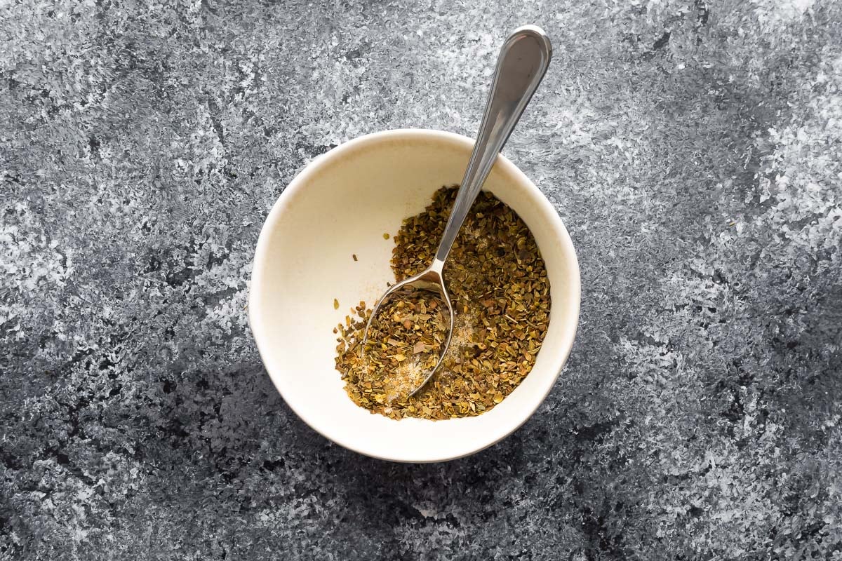seasoning blend in white bowl with spoon