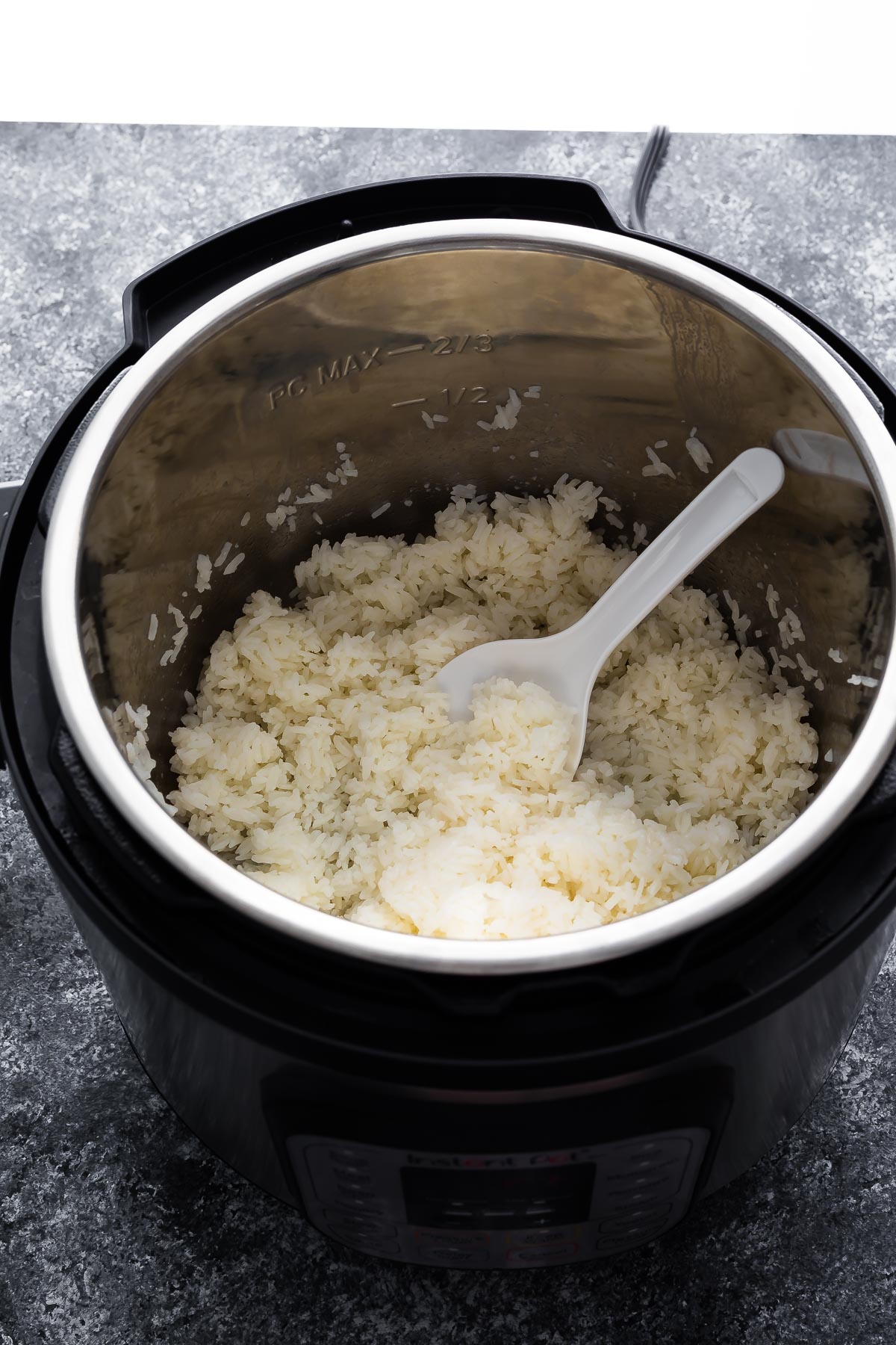 cooked jasmine rice in the instant pot with rice paddle