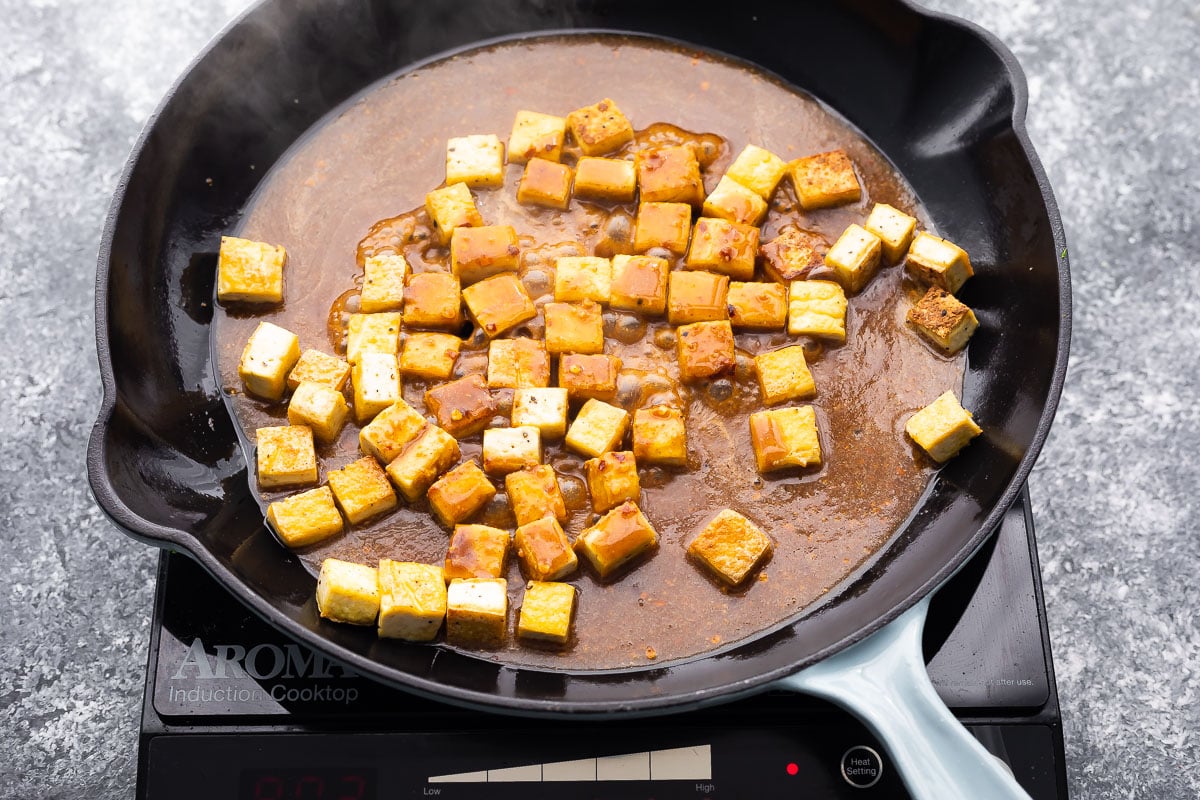 tofu simmering in peanut sauce