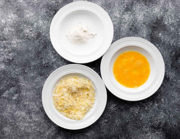 three bowls with flour, eggs, and panko