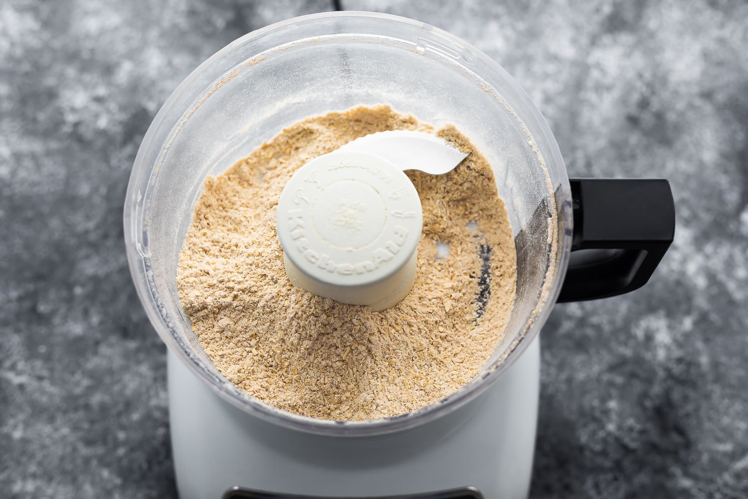 blended dry ingredients in food processor for protein bars