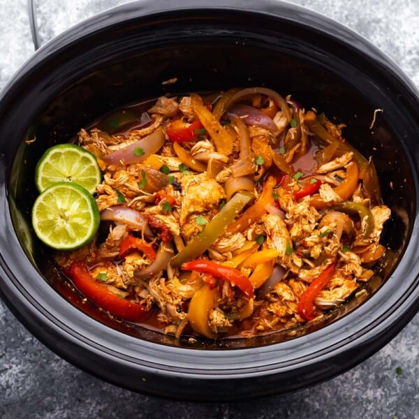 slow cooker chicken fajitas in the slow cooker after cooking through