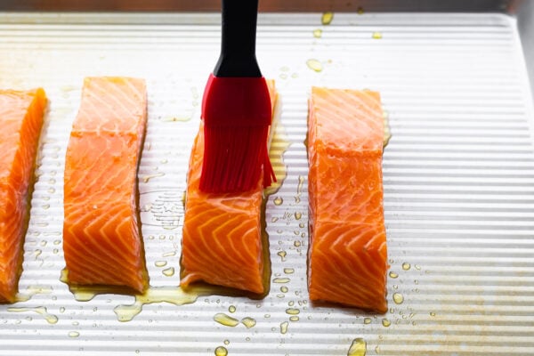 brushing salmon with olive oil