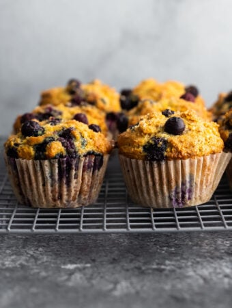 side angle view of blueberry muffins on wire rack
