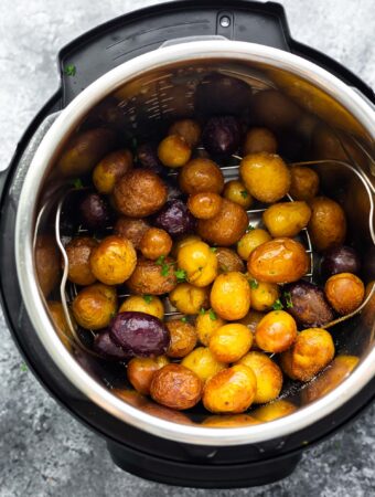 overhead view of baby potatoes in instant pot after cooking and air frying