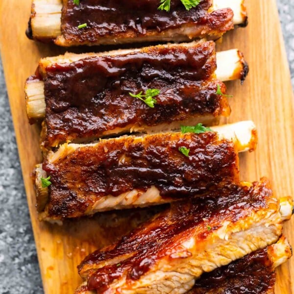 close up view of instant pot ribs, cut and laid out on cutting board