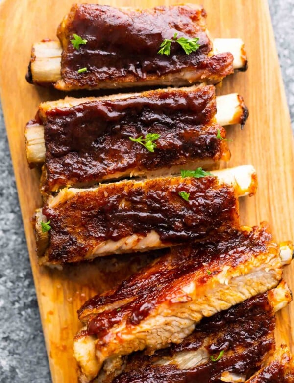 close up view of instant pot ribs, cut and laid out on cutting board