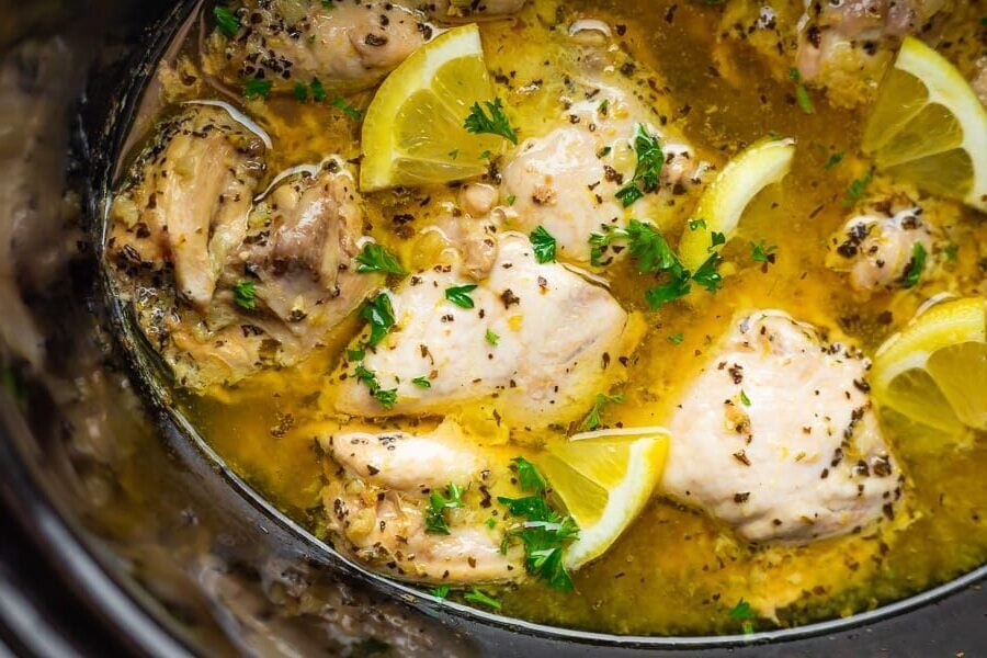 close up view of slow cooker lemon chicken in crockpot after cooking