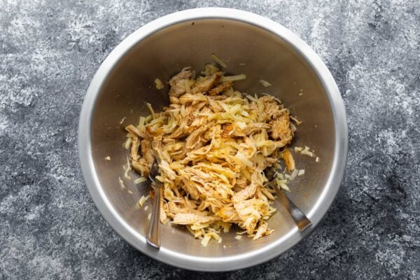 shredded chicken and cheese tossed together