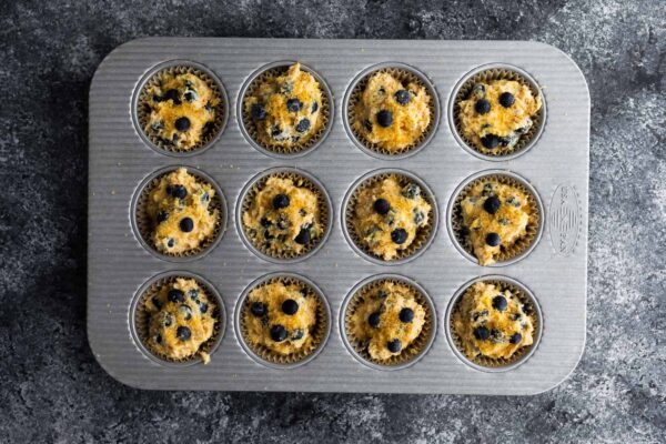 blueberry muffins in muffin pan before baking