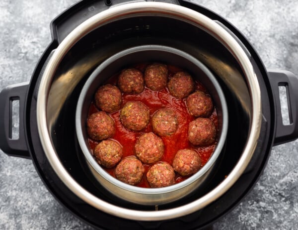 meatballs in marinara sauce inside a cake pan in the instant pot