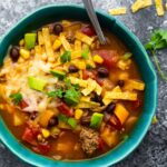 overhead view of bowl of taco soup with spoon