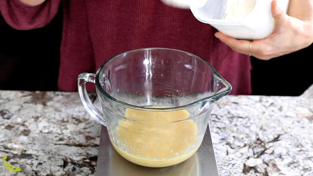 mixing up wet ingredients for breakfast cookies in large glass measuring cup