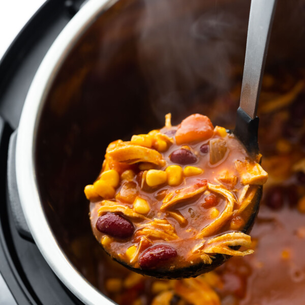 close up shot of chicken chili on ladle