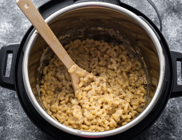 macaroni and cheese in instant pot with wooden spoon