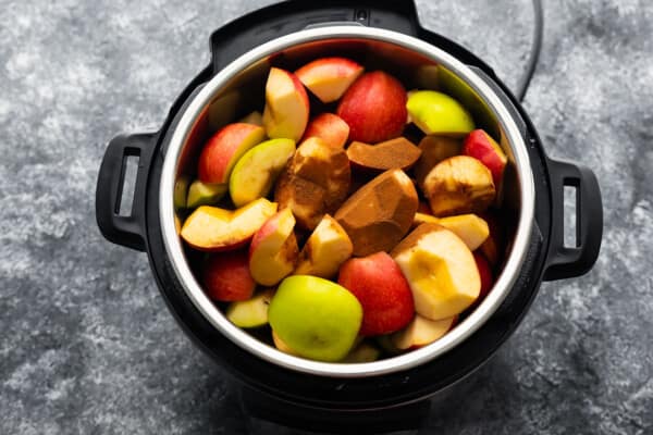 overhead view of instant pot filled with apples and cinnamon