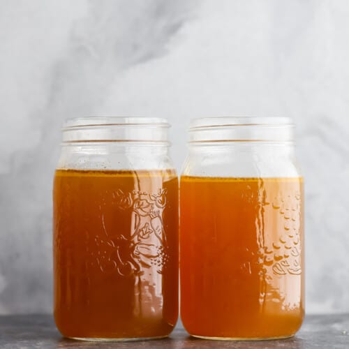 two jars of chicken stock