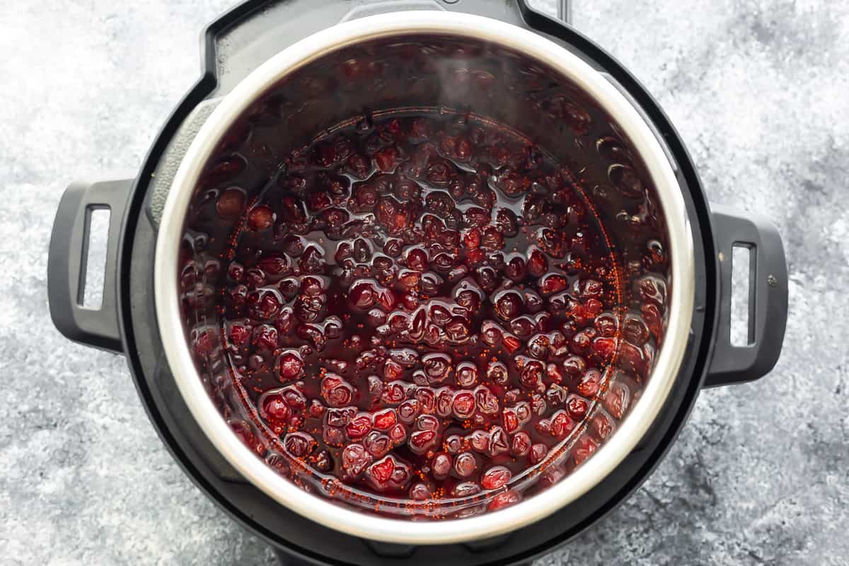 overhead view of instant pot after cooking cranberry sauce