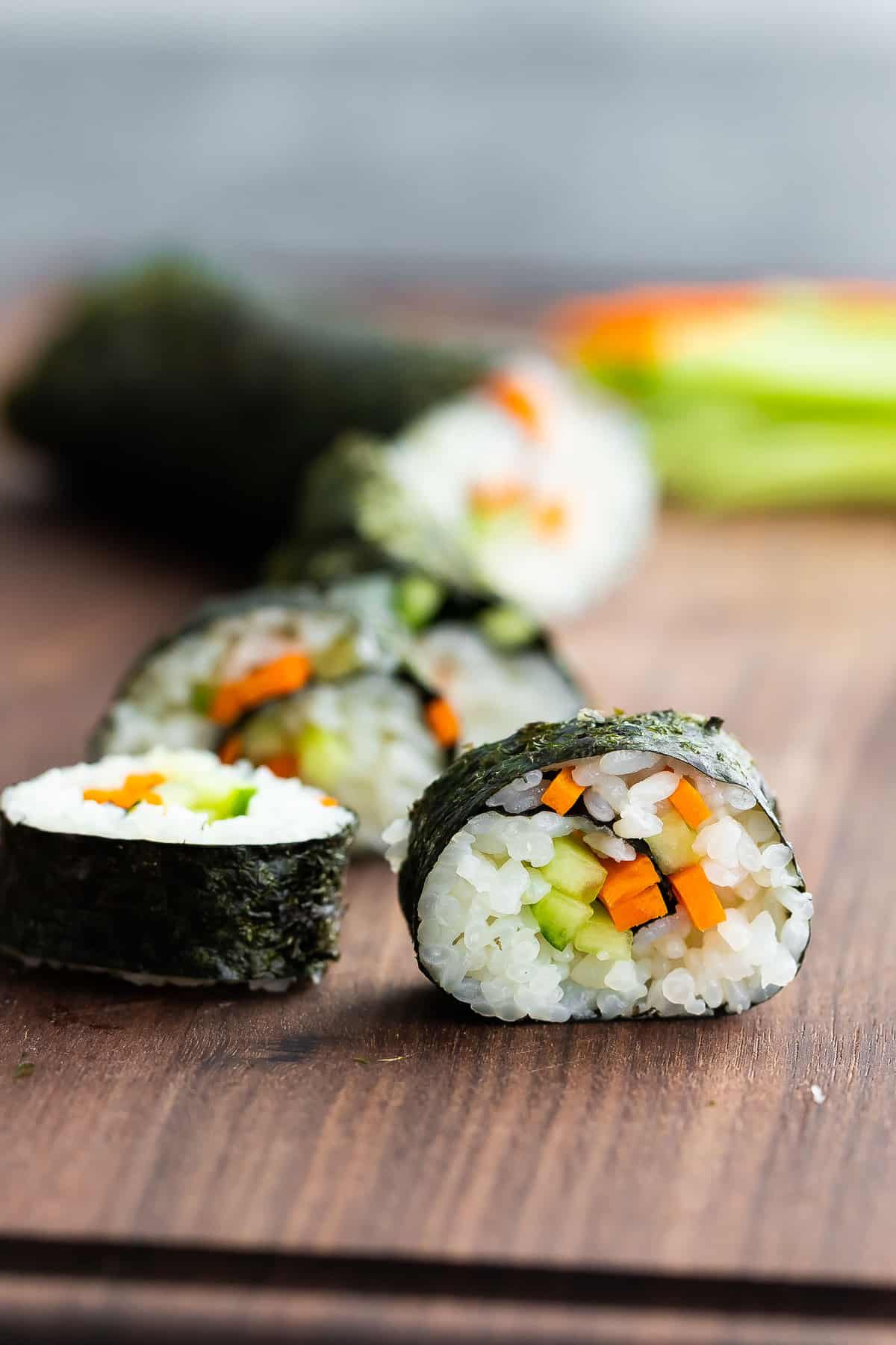 close up view of sushi roll on cutting board