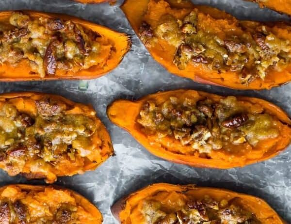 overhead shot of twice baked sweet potatoes in a row on parchment