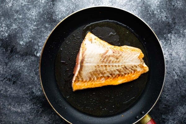 salmon flipped over in pan