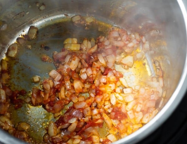 onions and garlic sauteed in tomato paste in instant pot