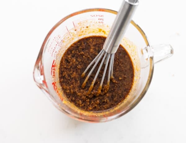 peanut sauce ingredients mixing up in measuring cup